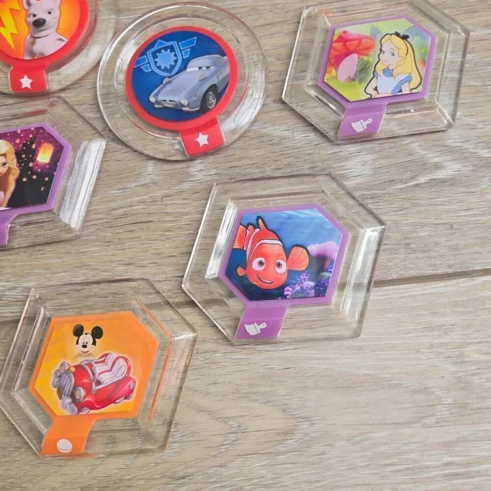 Disney Infinity power disc's lot of 11 Mulan, mickey, rapunzel, Alice, Nemo, car
